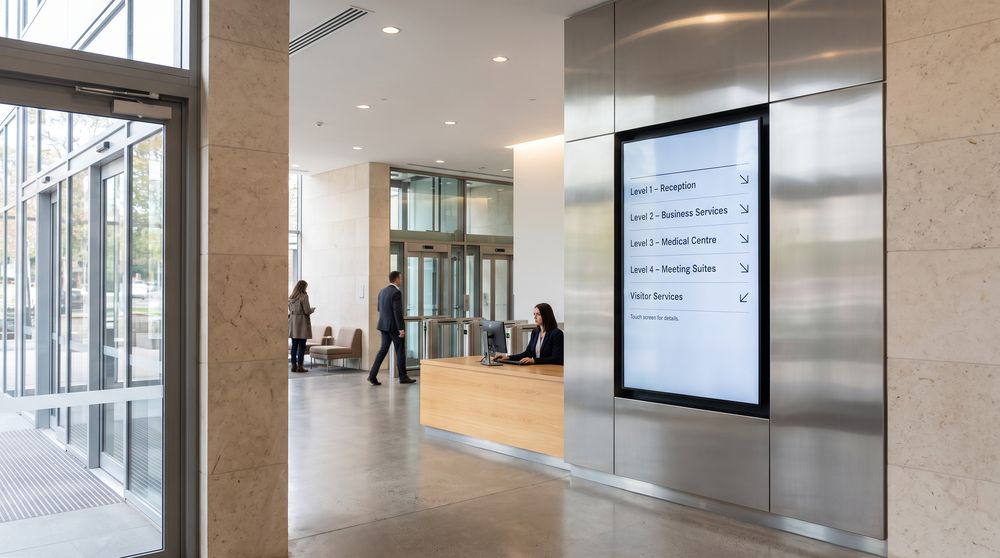 Digital directory screen listing tenants, departments and services at a building entrance